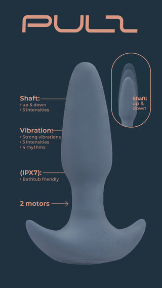 Grå analvibrator i silikon med böjd bas och två motorer, utrustad med fjärrkontroll.