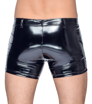 Person bär Black Vinyl Kalsonger i en fetischlook, fotograferad bakifrån mot en enfärgad bakgrund.