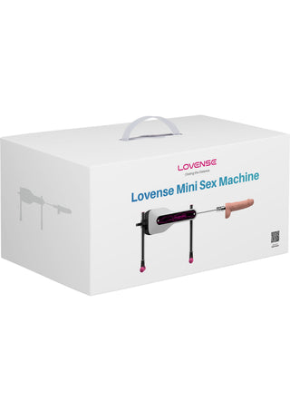Kompakt vit Lovense Mini Sexmaskin med handtag, avbildad på produktförpackningen med en tydlig produktbild.