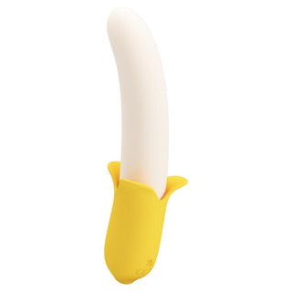 Bananformad vibrator i silikon i gult och vitt, med design som en skalad banan och multifunktionella reglage.