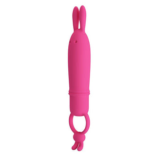 Rosa bulletvibrator i silikon med långa kaninöron och ringformad bas, mot en vit bakgrund.