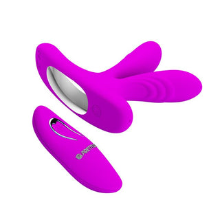 Lila silikonvibrator med två flexibla armar och en fjärrkontroll, mot en vit bakgrund.