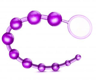 B-Yours Basic Beads har en lila graderad design och öglahandtag för säkert grepp, som visas på en vit bakgrund. Deras flexibla struktur säkerställer komfort och användarvänlighet.