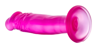 Rosa dildo i silikon, 16 cm lång med utsvängd bas och sugkopp, visas mot vit bakgrund.