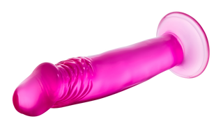 Rosa genomskinlig dildo, 16 cm lång, med sugpropp, tillverkad av slätt material, visas mot en vit bakgrund.