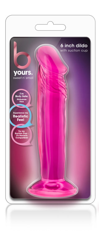 Dildo i rosa silikon, 16 cm lång, med sugproppsfäste och sele, visas i genomskinlig förpackning.