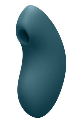 Tealfärgad bönformad vibrator med cirkulär öppning, tillverkad av medicinsk silikon, mot vit bakgrund.
