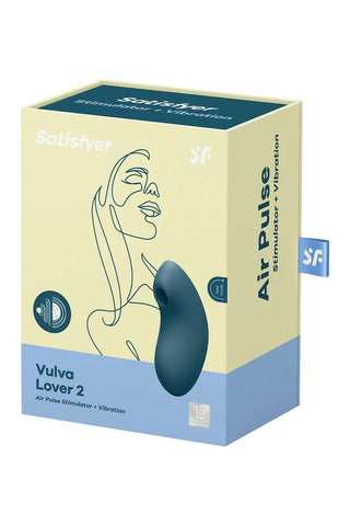 Satisfyer Vulva Lover 2: klitorisstimulator i silikon i låda med abstrakta ansiktsbilder i mjuka rosa och blå toner.