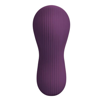 Lila silikonvibrator med strukturerad yta, smal mitt och rundade ändar mot en vit bakgrund.