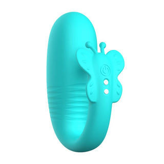 Turkosfärgat vibratorägg i silikon med fjärilsdesign och strömknapp på framsidan.