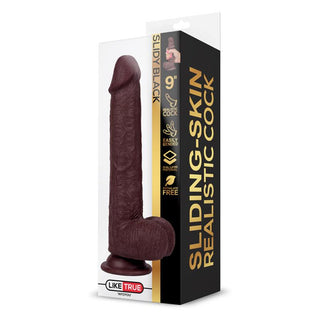 Hyperrealistisk dildo i två lager, 22 cm, hudfärgat TPE med strukturerade detaljer och sugfot, avbildad i genomskinlig förpackning.