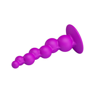Analplugg i lila silikon, 17 cm lång med utsvängd bas, visas mot en vit bakgrund.