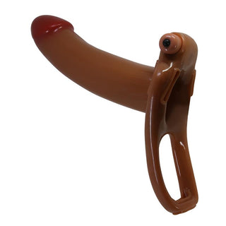 En rosa, realistisk, bananformad strap-on-leksak i silikon med handtag, utformad för bärbar användning.