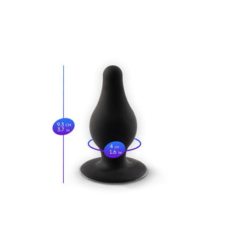 Svart analplugg med dubbel densitet tillverkad av Silexpan, med en utvidgad bas, 9,3 cm hög och 4 cm bred.