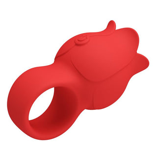 Fingervibrator i röd silikon med strukturerad yta och knapp på sidan.