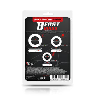 Beast Cockring Set 3-Pack förpackning framhäver produktdetaljer och storlekar (L, M, S), användningsvarningar och tillverkarens logotyp i en svart, röd och vit design. Tillverkad av kroppssäkra material, den har en streckkod i botten för enkel skanning.