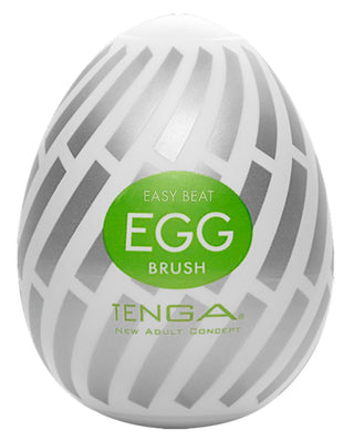 Vit och grå Tenga Egg Brush med grön etikett "Easy Beat Egg Brush", utformad som ett praktiskt engångsägg för nöjesbruk från Tenga New Adult Concept.