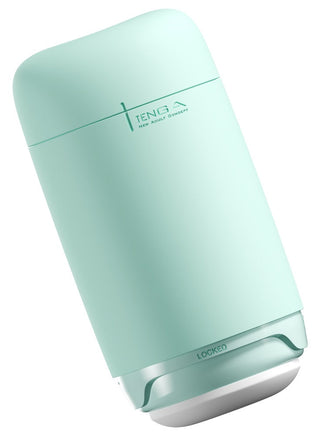 Tenga Puffy Masturbator Mint Grön är en mintgrön cylinder med vit bas och sidotext, med mjuk silikondesign och massagetexturer för en lyxig upplevelse.