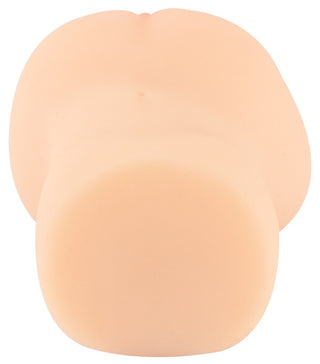 Köttfärgad masturbator i silikon med rundad bas och två böjda delar, mot en vit bakgrund.