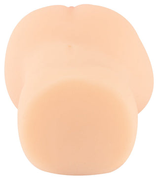 Köttfärgad masturbator i silikon med rundad bas och två böjda delar, mot en vit bakgrund.