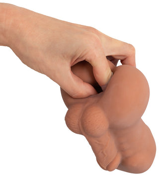 Realistixxx RealMan Anal Masturbator, en hudfärgad silikonleksak med realistiska anatomiska detaljer, mot en vit bakgrund.