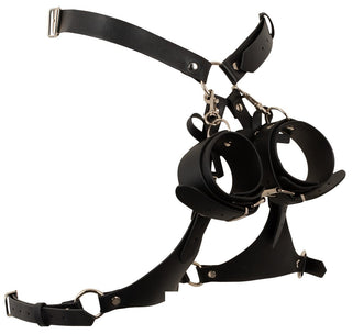 Svart bondage-höftsele i konstläder med metallnitar och integrerade handledsbojor för BDSM-fixering.