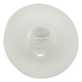 En genomskinlig, rund Rebel Penissleeve Med Kulring av silikon med ett centralt hål, visad uppifrån mot en vit bakgrund.