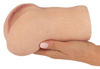 Realistixxx Real Stroker-masturbator, silikon, beige, med dubbel design (vagina och anus) avbildad mot en enfärgad vit bakgrund.