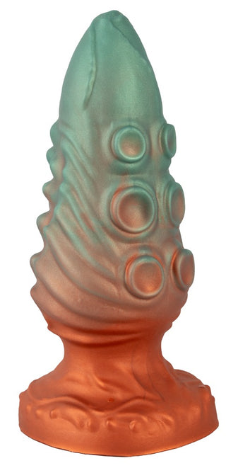 Beasty Cocks Atlantis Buttplug är en orange och grön silikonplugg med fantasy-tema med texturerade åsar, upphöjda cirkulära mönster och en robust sugkoppsbas. Tillverkad av flytande silikon för en mjuk känsla.