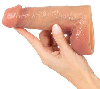 Realistixxx RealSleeve Intensiv penishylsa, köttfärgad, realistisk design, mjukt material, visas mot en vit bakgrund.