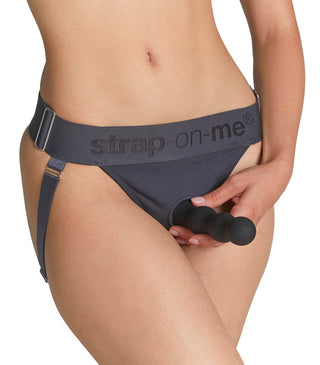 Svart dildofäste med tre silikonpärlor som hålls med en Unique Strap-on Harness Jock, båda visas tillsammans.
