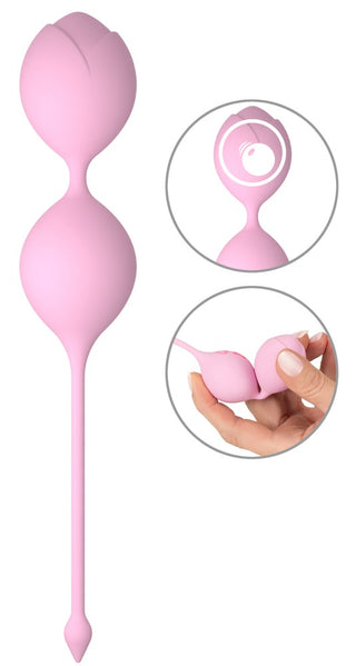 Rosa dubbla kärleksbollar i silikon med utdragningssnöre, slät design, avbildade vilande på en öppen handflata.