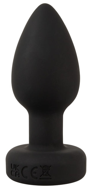 En svart LED Buttplug med Vibration med en utsvängd bas står upprätt mot en vit bakgrund, med elegant silikondesign och lekfull LED-belysning.