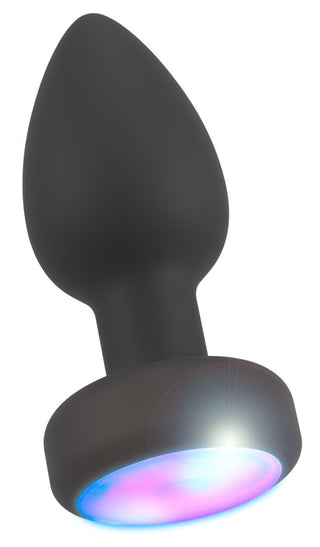 LED Buttplug med Vibration i silikonsort med utsvängd bas och LED-belysning, som lyser i blå och rosa nyanser.