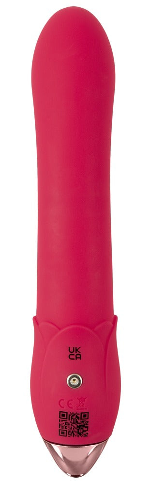Showers to Orgasm Duschvibrator är en rosa vibrator i silikon med metallisk bas, visad upprätt mot vit bakgrund. Vattentät och uppladdningsbar med 10 intensiva vibrationslägen.