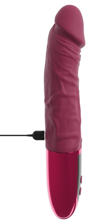 Dildovibrator med ådrad struktur i silikon, inklusive laddningssladd, visas mot vit bakgrund.