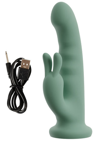 LUVIO Soft Rotating Rabbitvibrator, tillverkad av mjuk silikon och med ett kaninformat fäste, visas bredvid en svart USB-laddningskabel.