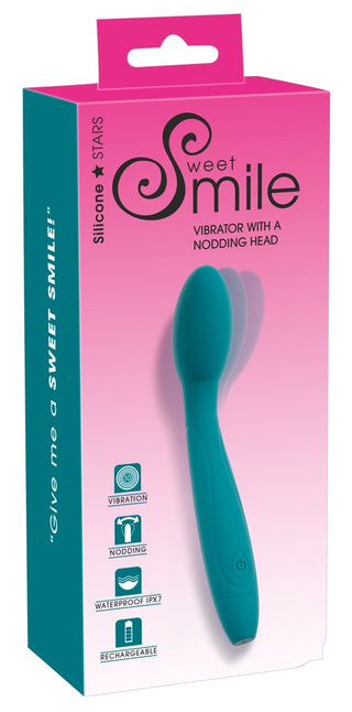 Vibrator med Nickande Huvud i turkos nyans levereras i rosa Sweet Smile-förpackning, med ikonöversikt. Perfekt för G-punktsstimulans och vattentät för extra njutning.