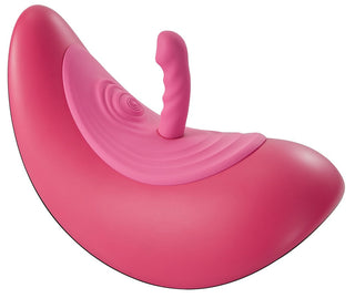 Vibepad RIDE ON är en ljusrosa, halvmåneformad handsfree-stimulator med en böjd bas och texturerat centralt handtag utformat för förbättrad klitorisstimulering.