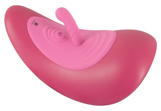 Vibepad RIDE ON är en rosa, böjd gungleksak med ett centralt handtag som är utformad för barn att sitta och balansera på - den är inte avsedd som en klitorisstimulans.