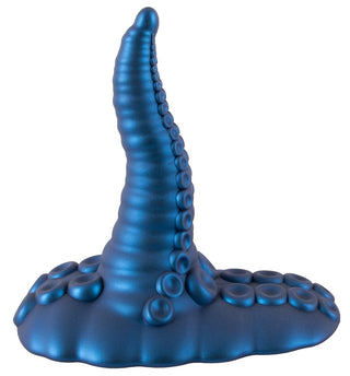Tentacle Pad Sit On Vibrator är en blå, böjd vibrator med sugkoppsdetaljer och en platt bas för handsfree-stimulering.