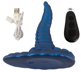 Tentacle Pad Sit On Vibrator är en blå, tentakelformad vibrator med en sugkoppsbas som inkluderar en USB-kabel och svart fjärrkontroll för enkel handsfree-stimulering.