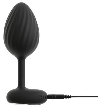 ANOS RC Buttplug Set är en svart analplugg i silikon med räfflad bulb, utsvängd bas och laddningskabel - perfekt för att utforska nya sensationer.