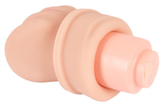 Realistixxx RealMasturbator Lösvagina är en köttfärgad, cylindrisk masturbator tillverkad av Natureskin-material med vibrations- och sugfunktioner och knappar i ena änden, visad mot en vit bakgrund.
