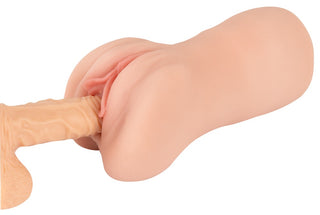 En närbild av Realistixxx RealMasturbator Lösvagina, tillverkad av verklighetstroget Natureskin-material.