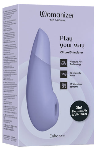 Bilden visar Womanizer Enhance Luftvibrator-förpackningen bredvid en We-Vibe-produkt. Den lila och vita rutan framhäver funktioner som Pleasure Air Technology, 10 intensitetsnivåer och 10 vibrationsmönster.