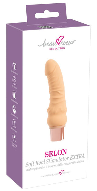 Selon Extra Dildovibrator, rosa mjuk TPE-vibrator med böjd design för stimulering av G-punkten visas i klar produktförpackning.