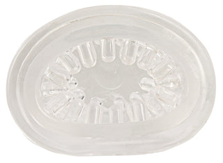 En masturbator i genomskinlig plast med gjutna spår och indragna delar som liknar tänder, visad från en ovanifrånvinkel.