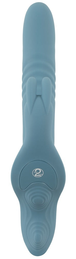 Blå silikonvibrator av typen ”strap-on” med ”rabbit”-funktion, strukturerade detaljer och två förlängningar för dubbel stimulering.