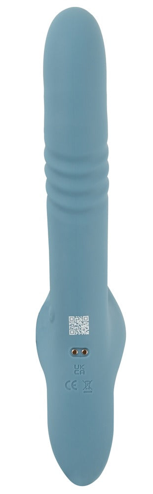 Blå silikonvibrator av typen ”strap-on rabbit” med räfflad skaft, böjd bas och laddningsuttag på undersidan.